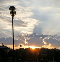 Low angle view of street light against sky