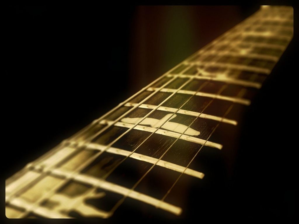 indoors, close-up, selective focus, music, night, pattern, arts culture and entertainment, illuminated, musical instrument, no people, guitar, part of, focus on foreground, dark, architecture, musical equipment, musical instrument string, metal, design, built structure