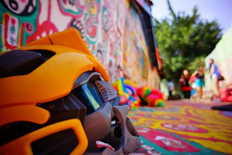 multi colored, focus on foreground, incidental people, art and craft, arts culture and entertainment, close-up, cultures, colorful, tradition, outdoors, creativity, day, art, street, celebration, tree, toy, leisure activity, car