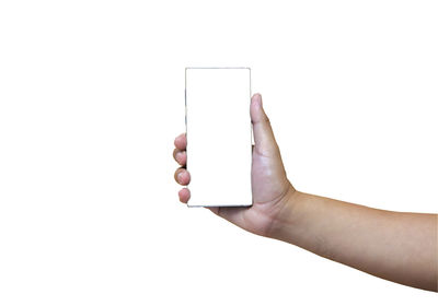 Midsection of person holding smart phone against white background