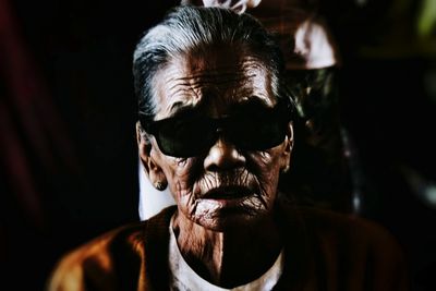 Close-up portrait of woman wearing sunglasses