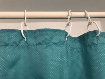 Close-up of clothes hanging on fabric