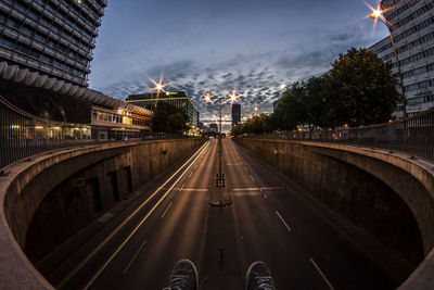 View of road passing through city at night