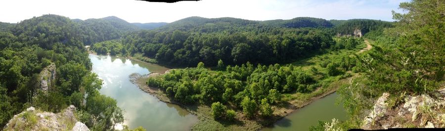 Panoramic view of lake and trees against sky