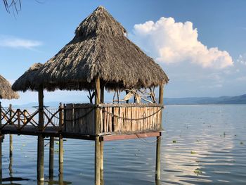 Gazebo by sea against sky