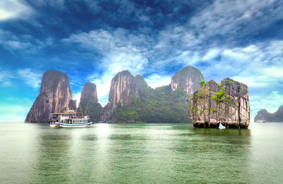 Panoramic view of boats in sea against sky