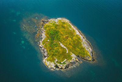 Aerial view of mountain by sea