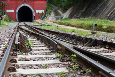 Old railroad tracks, steel railway for trains. railroad to red tunnel in thailand.