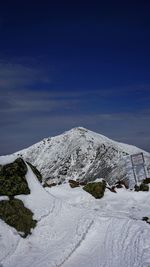 Scenic view of snowcapped mountain against sky