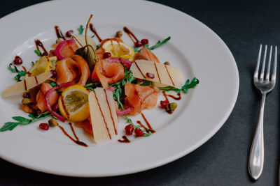 High angle view of fruits in plate on table