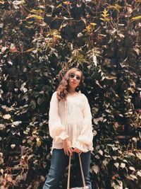 Portrait of a young woman standing outdoors