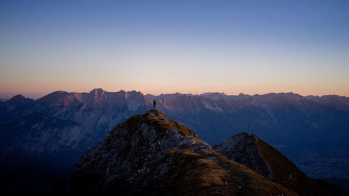 Panoramic view of mountain range against sky during sunset