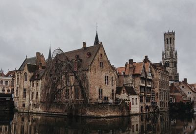 Panoramic view of buildings in city against sky