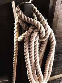 Close-up of ropes tied on wood