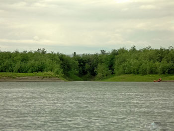 Scenic view of river against sky