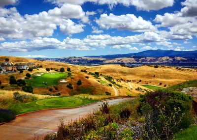 Scenic view of landscape against cloudy sky