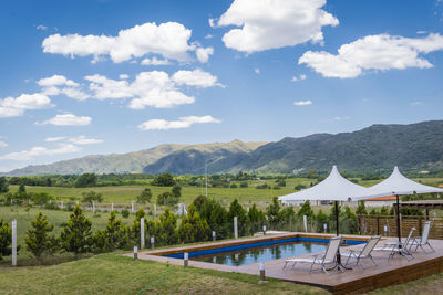 Tourist resort and landscape against sky