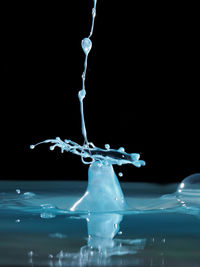 Close-up of water splashing on black background
