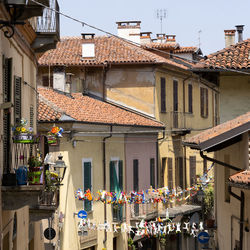 Houses in city against sky