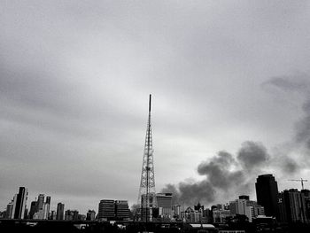 Cityscape against cloudy sky