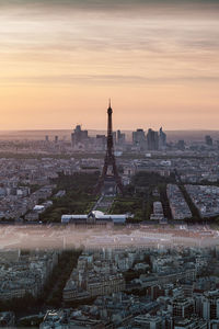 High angle view of eiffel tower at sunset with orange sky