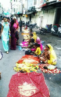 People at street market in city