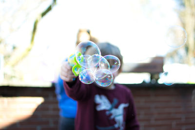 Man holding bubbles