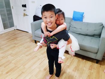 Portrait of happy friends at home