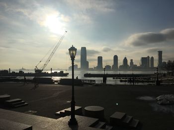 View of harbor against cloudy sky