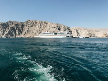 Scenic view of sea against clear blue sky