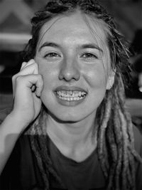 Close-up portrait of a smiling young woman