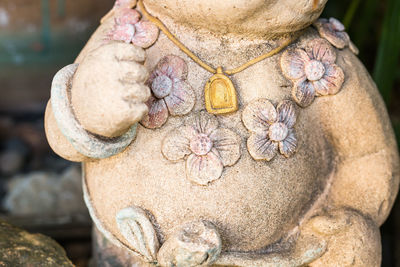 Close-up of human face on rock