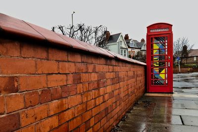 Text on wall against clear sky