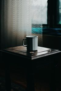 Close-up of coffee cup on table