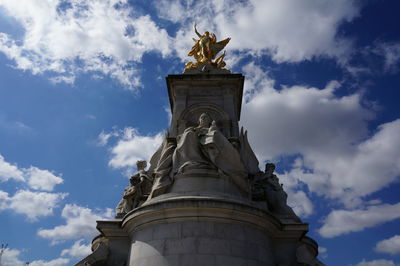 Low angle view of statue against sky