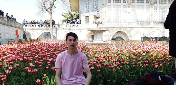 View of flowering plants against building