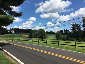 Empty country road along trees