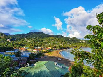 High angle view of buildings and trees against sky