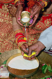 Midsection of woman holding ice cream