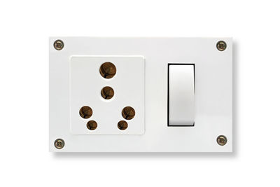 Close-up of telephone over white background