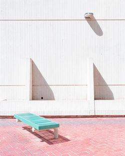 Bench against building