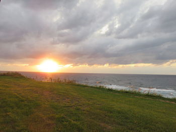 Scenic view of sea against cloudy sky