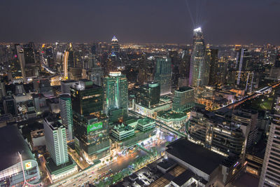 High angle view of illuminated modern buildings in city at night