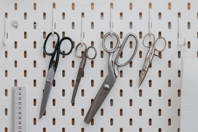 Close-up of text hanging on metal