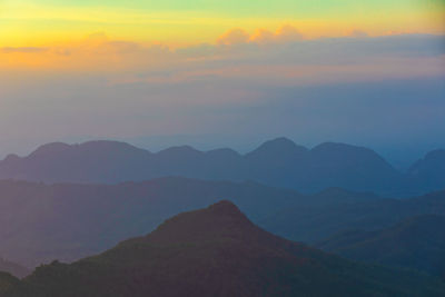 Scenic view of silhouette mountains against sky during sunset