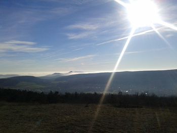 Scenic view of sunlight against sky