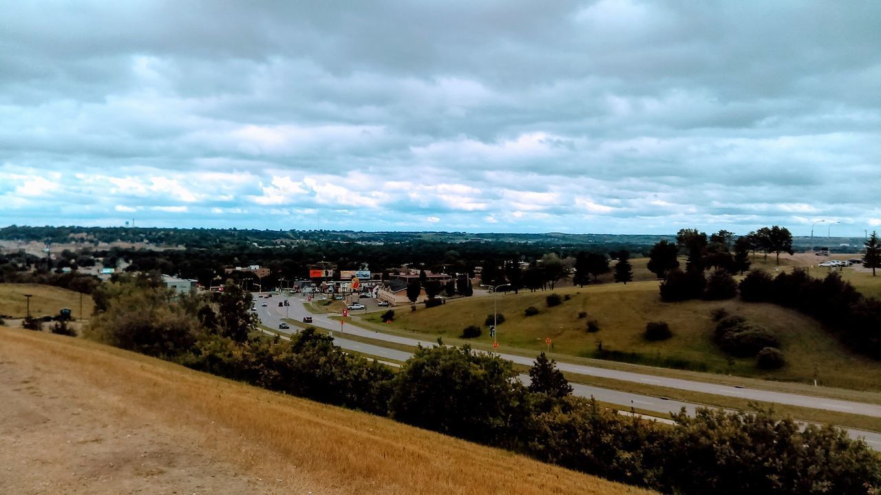 HIGH ANGLE VIEW OF ROAD AGAINST SKY