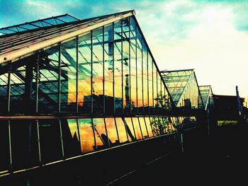 Low angle view of built structure at sunset