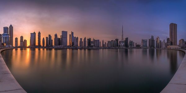 Panoramic view of city at sunset