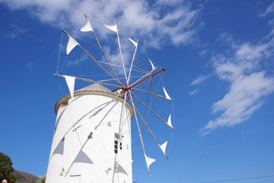 Low angle view of windmill against sky